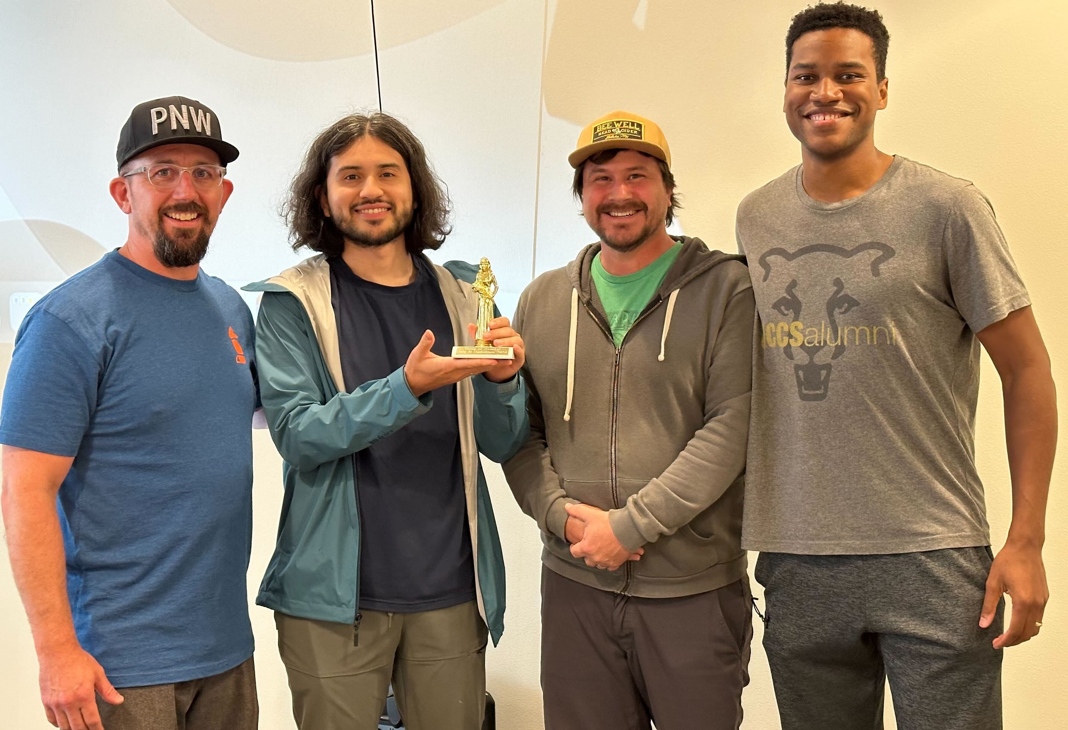 Me and my friends winning thing of beauty award at the Fixie LLM hackathon